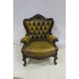 A VICTORIAN DESIGN MAHOGANY LIBRARY CHAIR with deep buttoned upholstered back and roll over arms