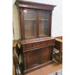 A 19TH CENTURY MAHOGANY LIBRARY BOOKCASE the outset moulded cornice above a pair of glazed doors