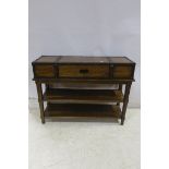 A CHERRYWOOD AND LEATHER BOUND CONSOLE TABLE with frieze drawer above two open shelves on square