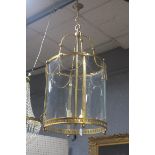 A VERY FINE CONTINENTAL GILT BRASS AND GLAZED FOUR LIGHT LANTERN of cylindrical form hung with