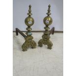 A PAIR OF 19th CENTURY CAST BRASS FIRE DOGS,