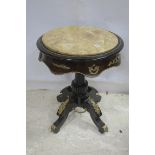 A CONTINENTAL WALNUT EBONISED AND GILT BRASS BOUND OCCASIONAL TABLE of circular outline with veined