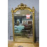 A GOOD 19TH CENTURY CONTINENTAL GILTWOOD AND GESSO MIRROR the rectangular arched bevelled glass