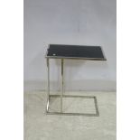 A CONTEMPORARY CHROME AND GLAZED OCCASIONAL TABLE of rectangular form on tubular base 58cm (h) x