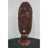 A CARVED WOOD FIGURE modelled as The Virgin Mary raised on a circular spreading foot