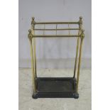 A 19TH CENTURY BRASS AND CAST IRON EIGHT COMPARTMENT STICK STAND 64cm (h) x 38cm (w) x 20cm (d)