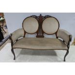 A 19TH CENTURY MAHOGANY INLAID AND UPHOLSTERED DOUBLE CHAIR BACK SETTEE with pierced and carved