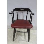 A STAINED WOOD AND UPHOLSTERED TUB SHAPED ELBOW CHAIR on turned legs