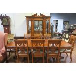 A GOOD NINE PIECE CROSS BANDED DINING ROOM SUITE comprising eight chairs including a pair of elbow