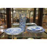 A COLLECTION OF ORIENTAL BLUE AND WHITE CHINA to include a hot plate three wall plaques and vase