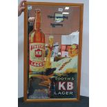 A FRAMED ADVERTISING MIRROR inscribed Tooths KB Large 98cm x 56cm
