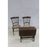 A 19TH CENTURY MAHOGANY SUTHERLAND TABLE together with a pair of rosewood side chairs with cane