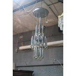 A SCIOLARI CHANDELIER Chrome and glass pendants hung in three registers chrome tubes and glass