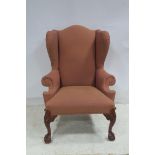 A GOOD PAIR OF GEORGIAN DESIGN MAHOGANY AND UPHOLSTERED WING CHAIRS each with scroll over arms on
