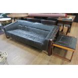 A LAFER VINTAGE HIDE UPHOLSTERED AND TEAK SETTEE AND FOOTSTOOL (2)