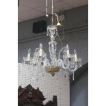 A CONTINENTAL CUT GLASS AND ENGRAVED GLASS SIX BRANCH CHANDELIER with spiral twists scroll arms and