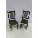 A PAIR OF STAINED BEECHWOOD SIDE CHAIRS with pierced vertical splats and panelled seat on turned