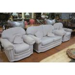 A THREE PIECE SUITE comprising two seater settee with loose cushions and scroll over arms together