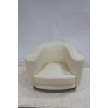 A PAIR OF RETRO HIDE UPHOLSTERED TUB SHAPED CHAIRS on cylindrical tapering legs