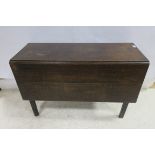 A GEORGIAN OAK DROP LEAF TABLE the rectangular hinged top raised on square moulded legs 71cm (h) x