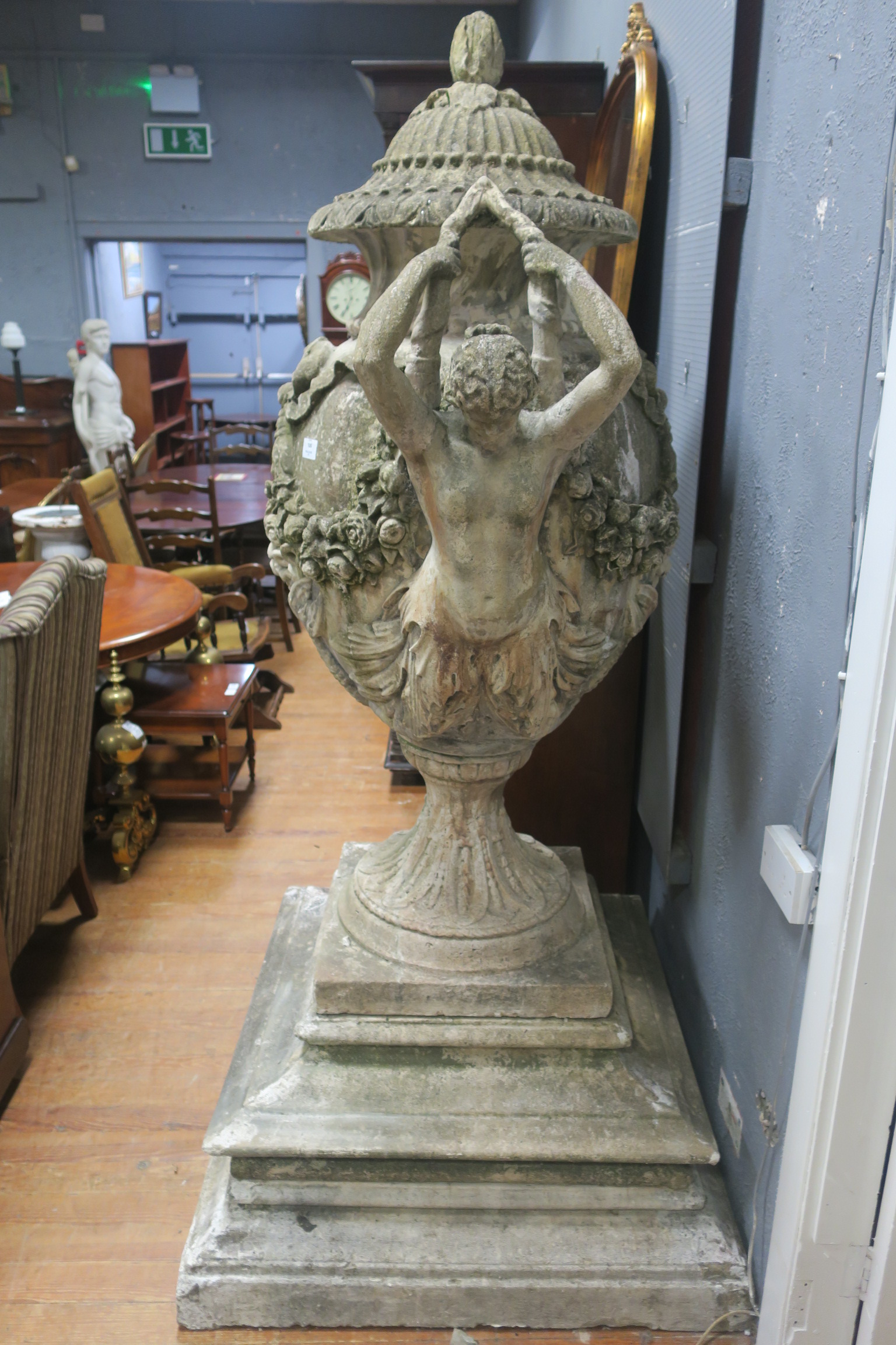 A VERY FINE AND IMPRESSIVE PAIR OF SANDSTONE URNS,