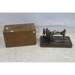 A PORTABLE SEWING MACHINE in an inlaid case with carry handle 31cm (h) x 49cm (w) x 24cm (d)