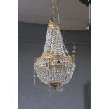 A CONTINENTAL GILT BRASS AND CUT GLASS SIX LIGHT CHANDELIER,