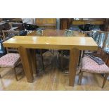 A RECLAIMED TEAK CONSOLE TABLE of rectangular outline the shaped top raised on square tapering legs