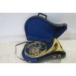 A FRENCH HORN in carrying case