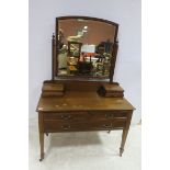 A MAHOGANY DRESSING TABLE WITH SATINWOOD STRING INLAY the superstructure with bevelled glass mirror