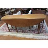 A GEORGIAN DESIGN MAHOGANY HUNT TABLE the oval hinged top raised on square moulded legs