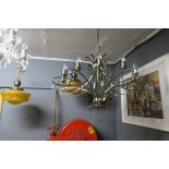 A RETRO CHROME TEN BRANCH CHANDELIER scroll intertwined arms