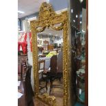 A CONTINENTAL GILTWOOD AND GESSO MIRROR the rectangular bevelled glass plate within a acanthus leaf