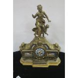 A 19TH CENTURY FRENCH GILT METAL MANTLE CLOCK the rectangular case surmounted with a female and