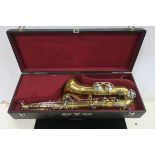 A BRASS AND PLATED SAXOPHONE IN CASE