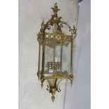 A CONTINENTAL GILT BRASS AND GLAZED FOUR LIGHT HALL LANTERN,