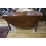 A GOOD GEORGIAN MAHOGANY DROP LEAF TABLE the oval hinged top with cabriole legs with pad feet 73cm