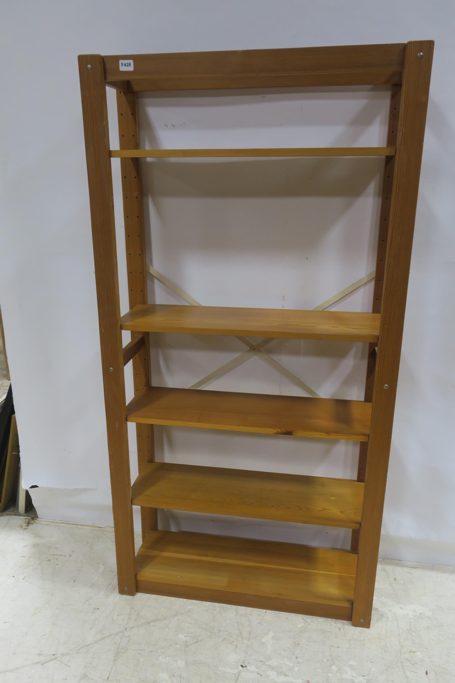 A PINE FIVE TIER OPEN FRONT BOOKSHELF