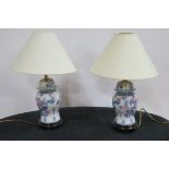 A PAIR OF ORIENTAL TABLE LAMPS each of baluster form on hardwood stands with shades 48cm (h)