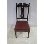 AN EDWARDIAN STAINED WOOD AND UPHOLSTERED SIDE CHAIR with pierced vertical splat and upholstered