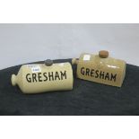 A PAIR OF VINTAGE STONEWARE HOT WATER BOTTLES inscribed Gresham
