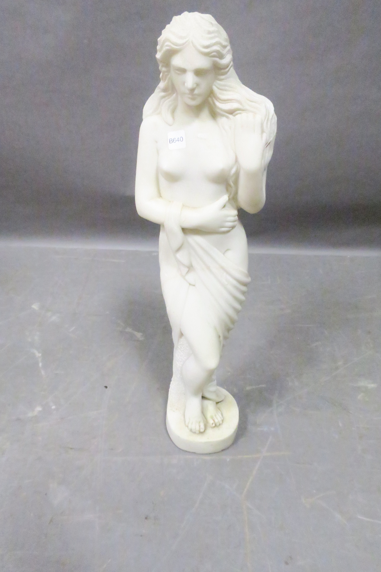 A WHITE STATUARY MARBLE FIGURE,