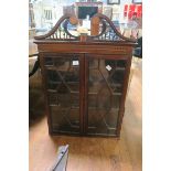 A GEORGIAN MAHOGANY AND SATINWOOD INLAID BOOKCASE TOP the pierced swan neck cornice above a pair of