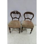 A PAIR OF 19TH CENTURY MAHOGANY SIDE CHAIRS each with a shaped top rail and splat with upholstered