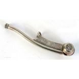 A silver bosun's whistle, of traditional form, the barrel with crowned fouled anchor badge to sides,
