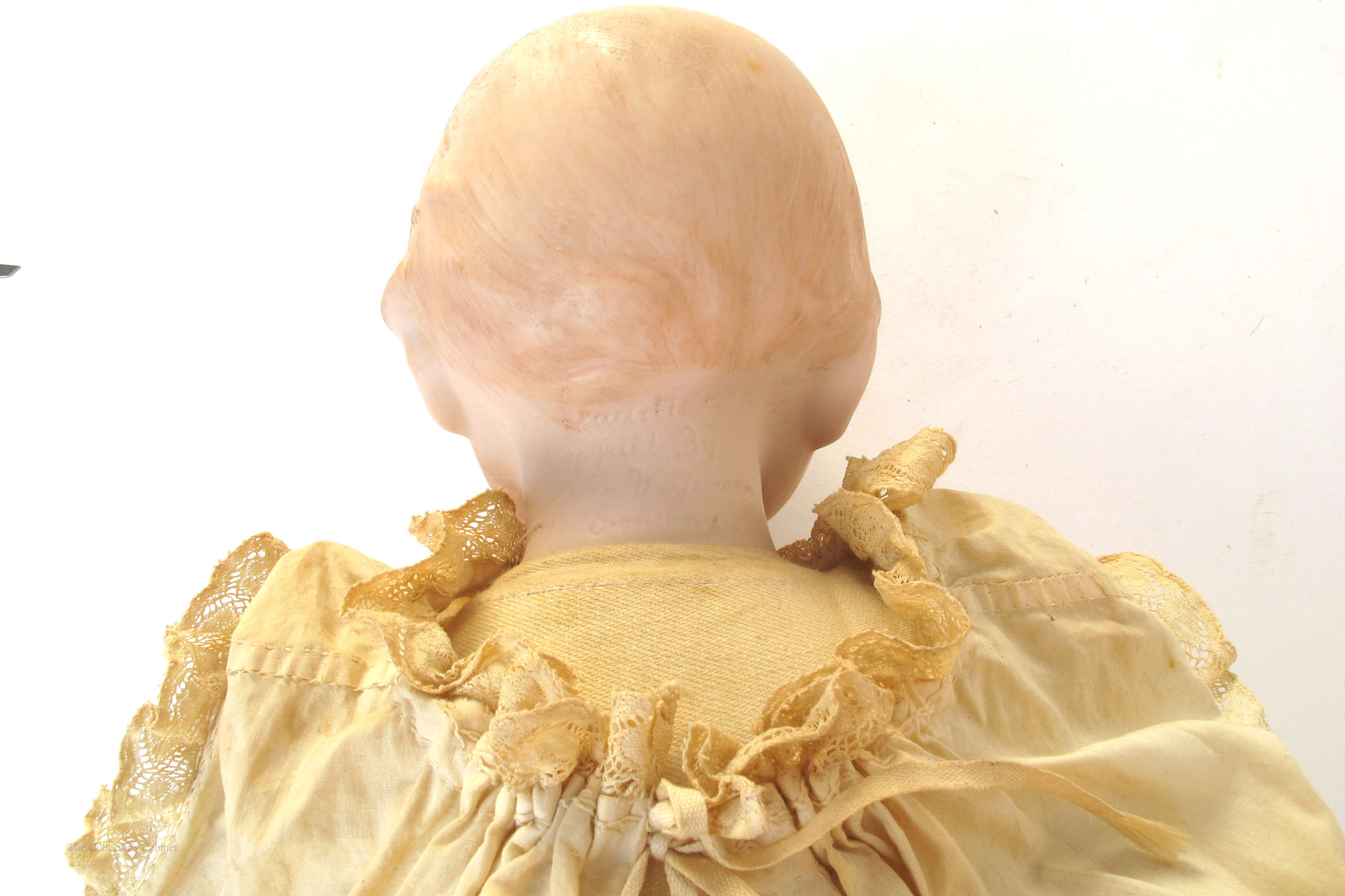 1920 A German bisque-headed baby doll, with moulded and painted hair, blue-grey glass eyes, - Image 2 of 2