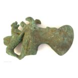 A bronze axe head, possibly Persian Luristan, the curved, broad blade,