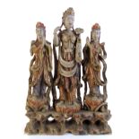 A Qing dynasty painted, carved wood Chinese figural group of a female deity with attendants,