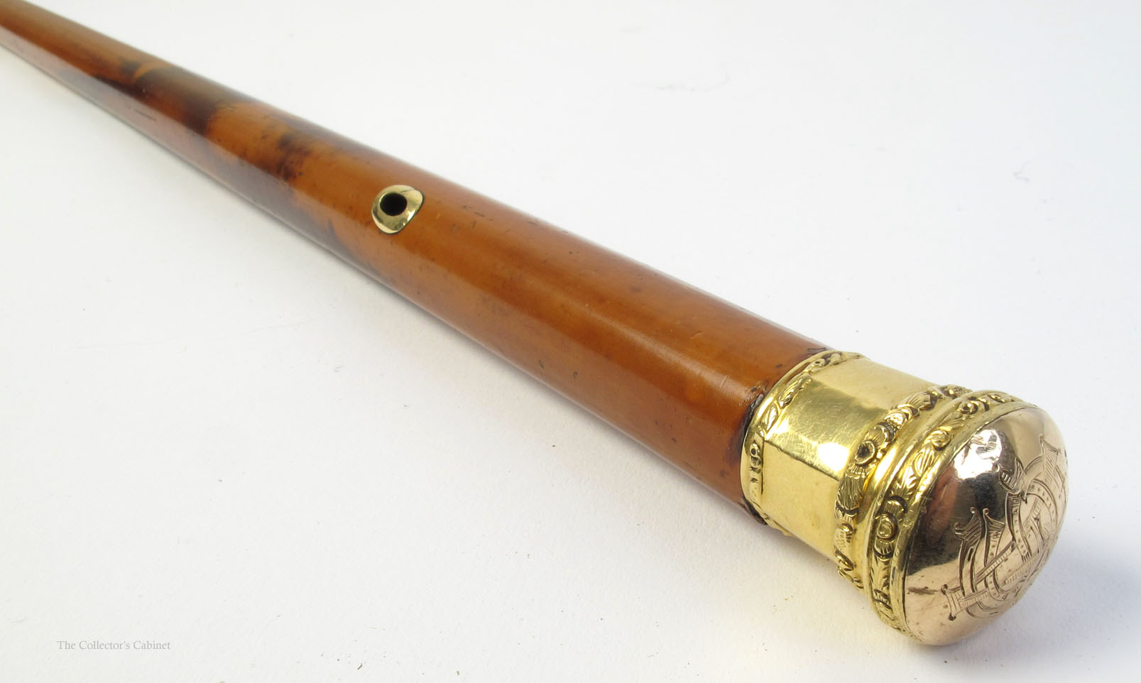 A 19th century gold mounted malacca cane.