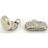 Two silver sovereign cases, a Victorian double sovereign case engraved with scrolling foliate motif,